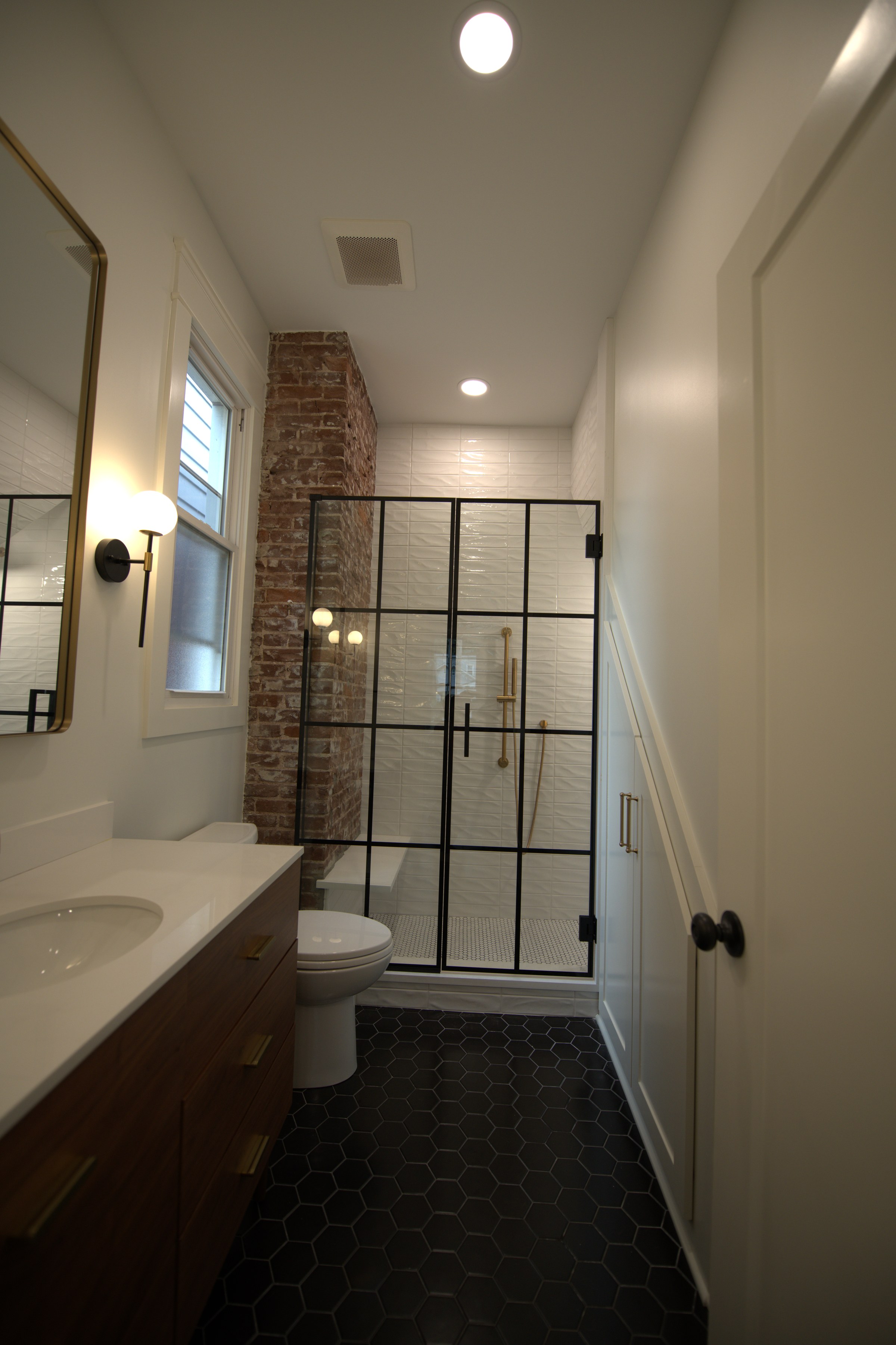 Hallway with shower stall visible
