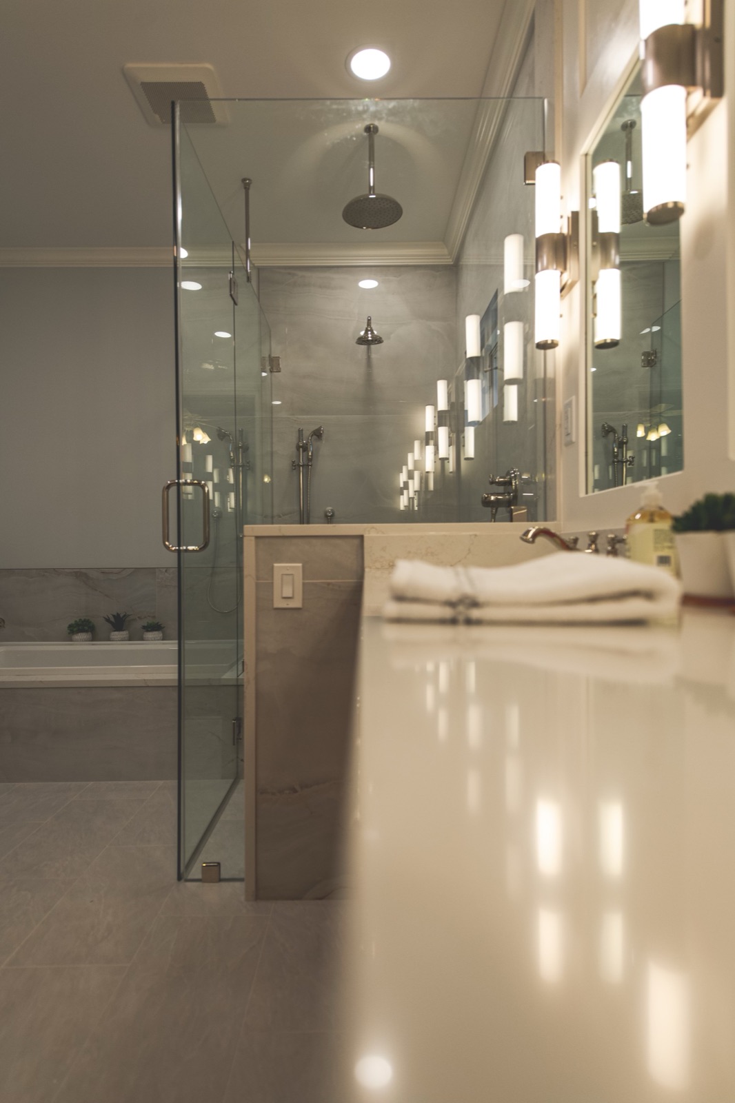 Bathroom lighting with pendant and recessed lights over vanity
